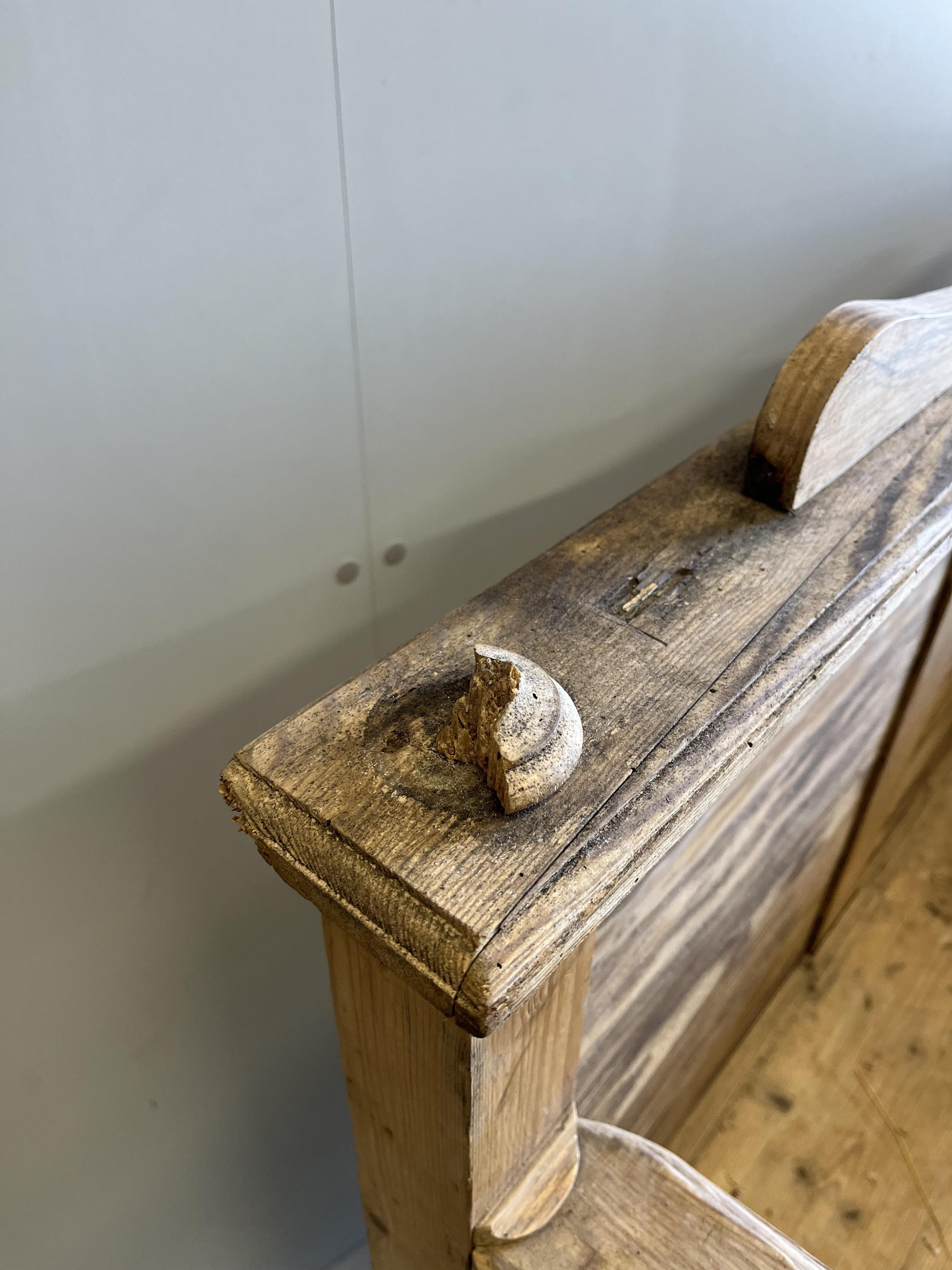 A Victorian style panelled pine settle, width 105cm, depth 60cm, height 110cm